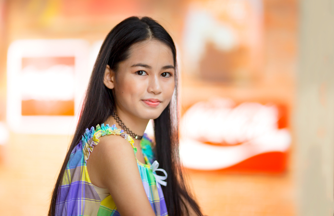 Portrait of a Smiling Teenage Girl with Long Hair 